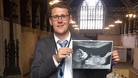 MP shows scan of unborn daughter in Parliament
