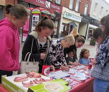 Signing pro life petitions at Youth for Life roadshow